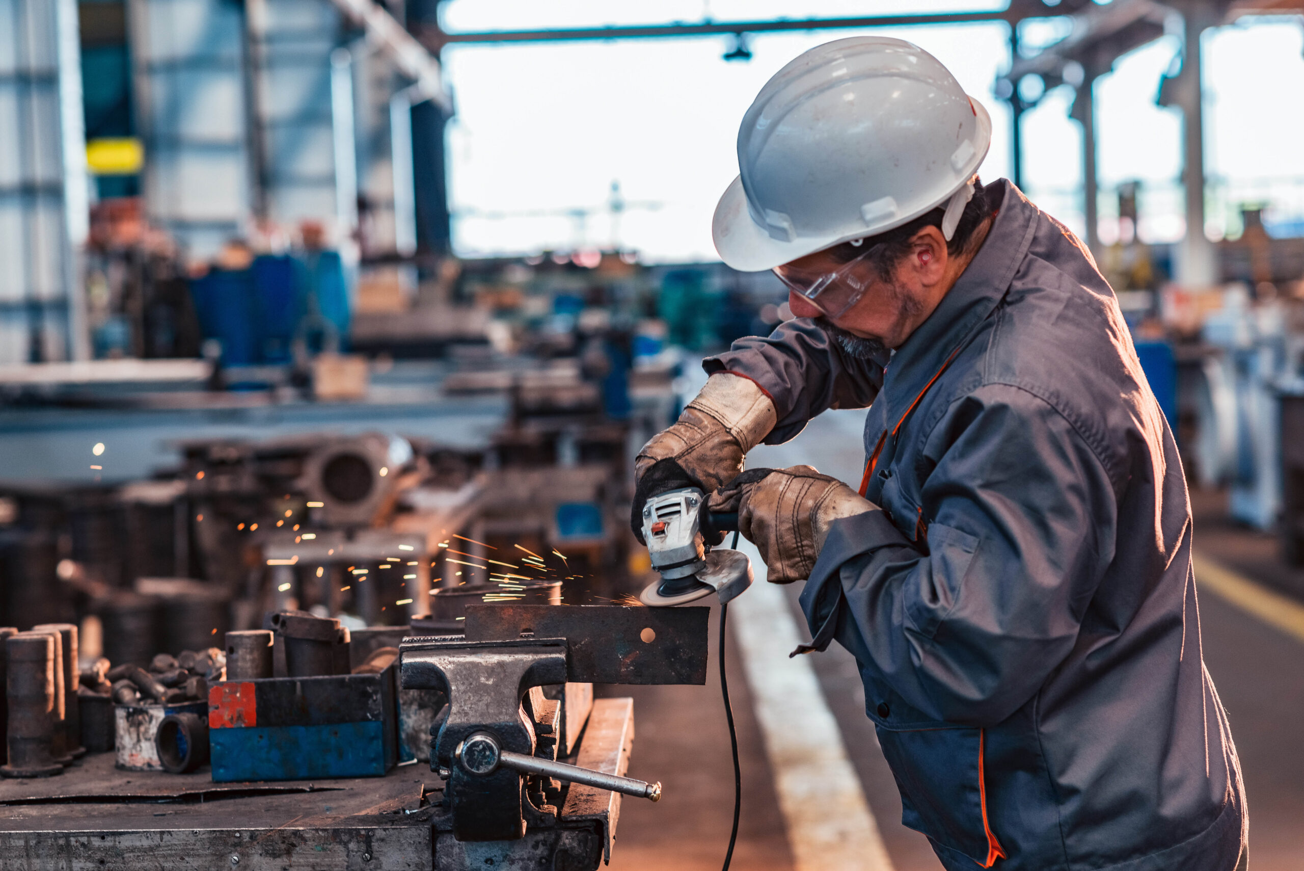 Man working in industry with earplugs